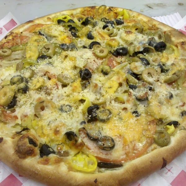 Catanzaro's Pizza with black olives, green olives, yellow peppers, and parmesan cheese.